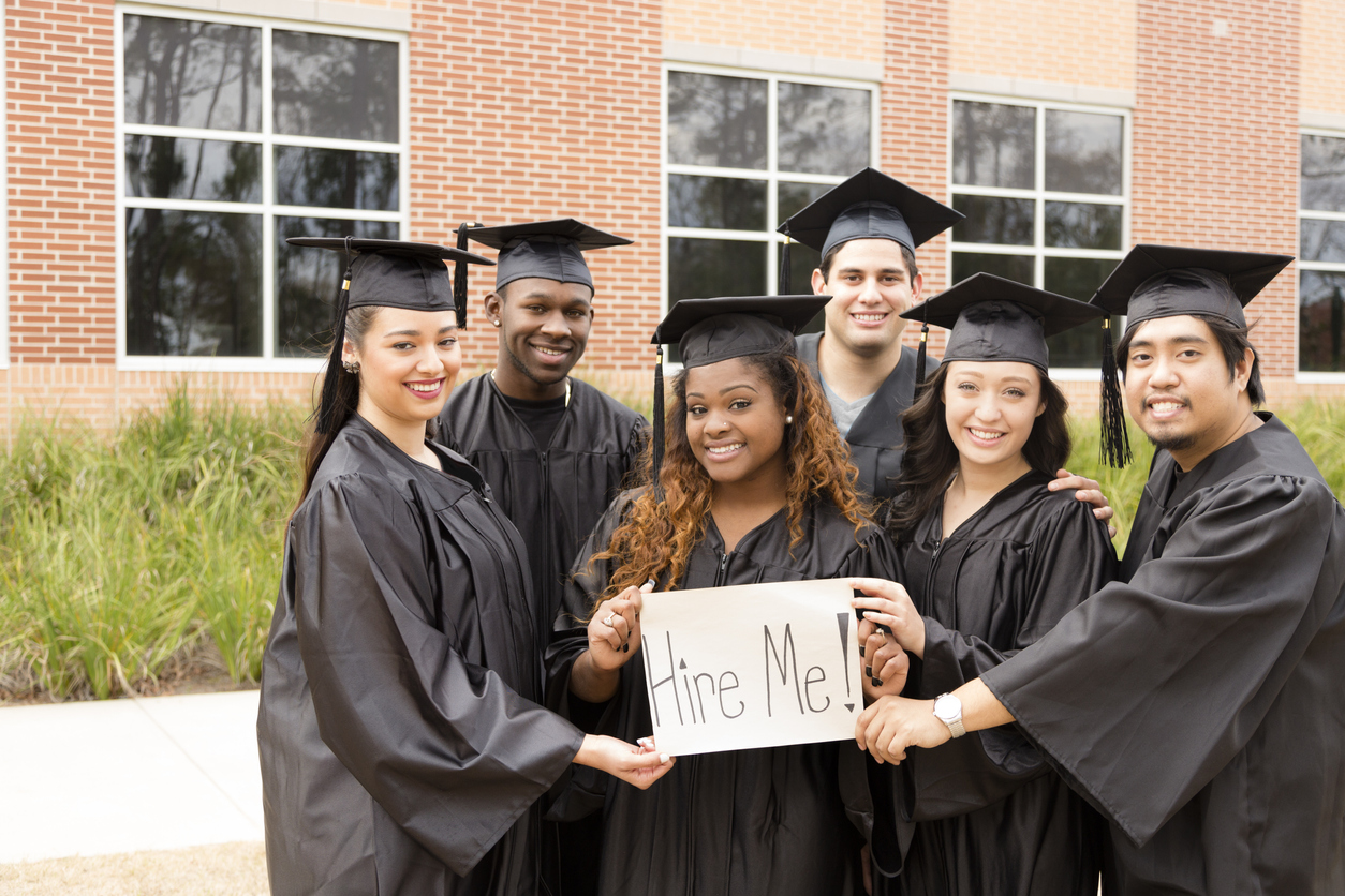 Diverse teens in cap and gown